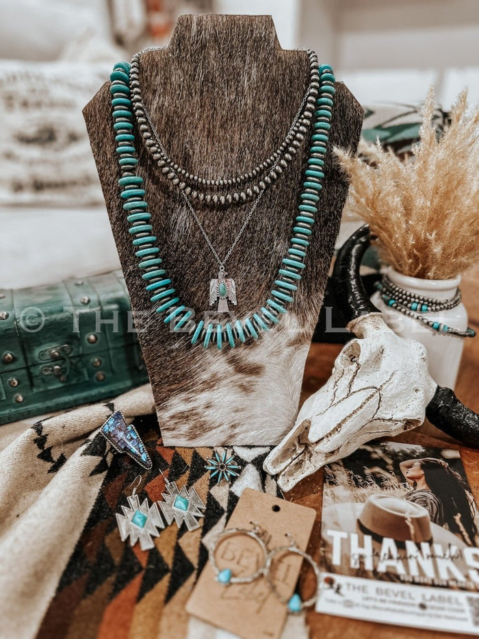 Handmade cowhide jewelry stand display setup