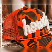 Howdy Patch Trucker Hat | Hunter Orange Camo - trucker hat